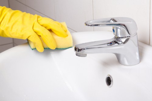 Domestic cleaning in an E14 kitchen and bathroom